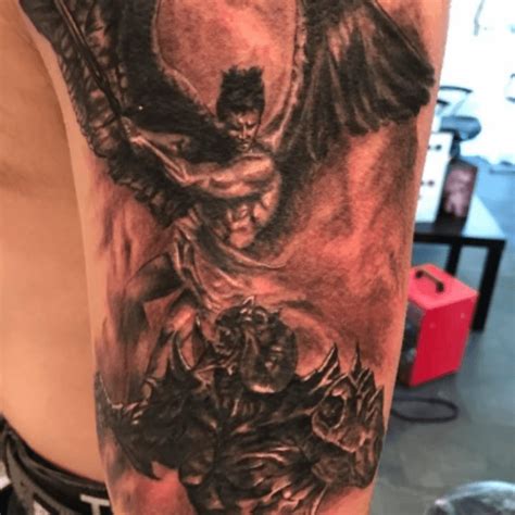 angel and devil fighting tattoos|More.